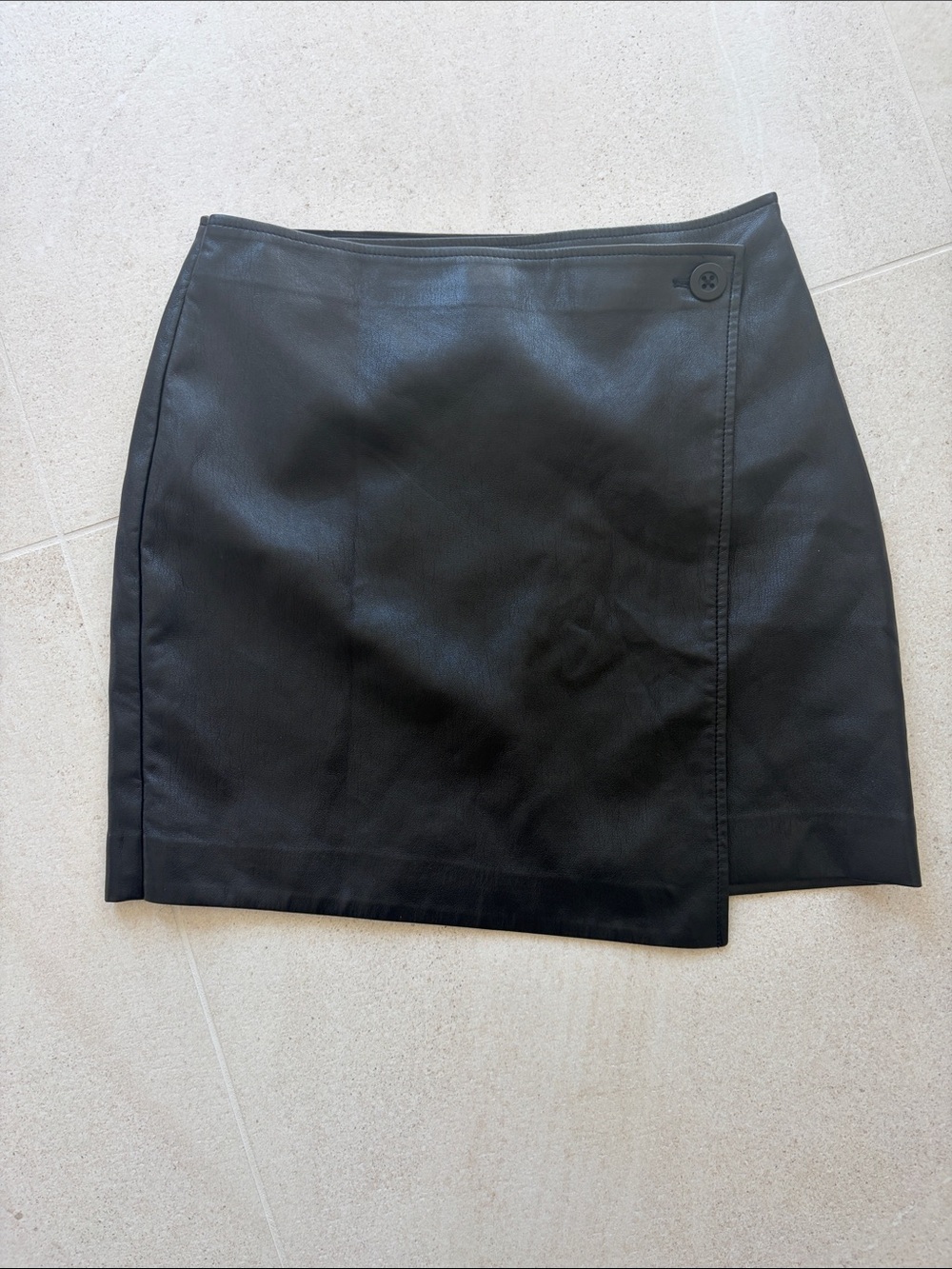 Babaton Black Faux Leather Mini Skirt with Wrap Button